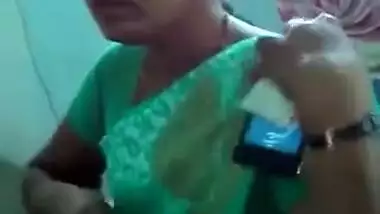 Horny Indian female un green helps man relax touching her XXX boobs