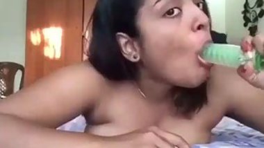 Naked Desi sweetheart seductively sucks XXX toy in front of camera